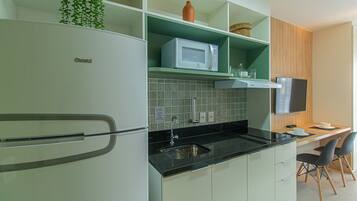 Fridge, microwave, stovetop, coffee/tea maker