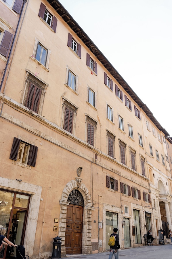 A historic building with multiple windows and a central entrance.