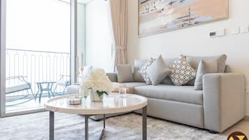 Luxury Apartment, City View | Living area | 65-inch Smart TV with cable channels