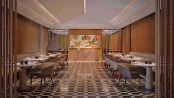 A restaurant with a checkered floor, wooden panel walls, and a central island.