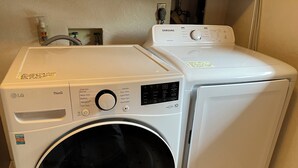 A front-loading washer and dryer side by side in a laundry room. - Spacious 5-bedroom house in marvelous Boise with AC, WiFi (Boise)