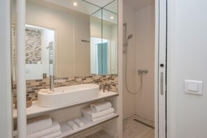 Economy Studio | Bathroom | Hair dryer, bathrobes, slippers, towels
