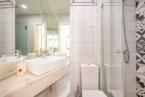 Shower, hair dryer, towels, soap