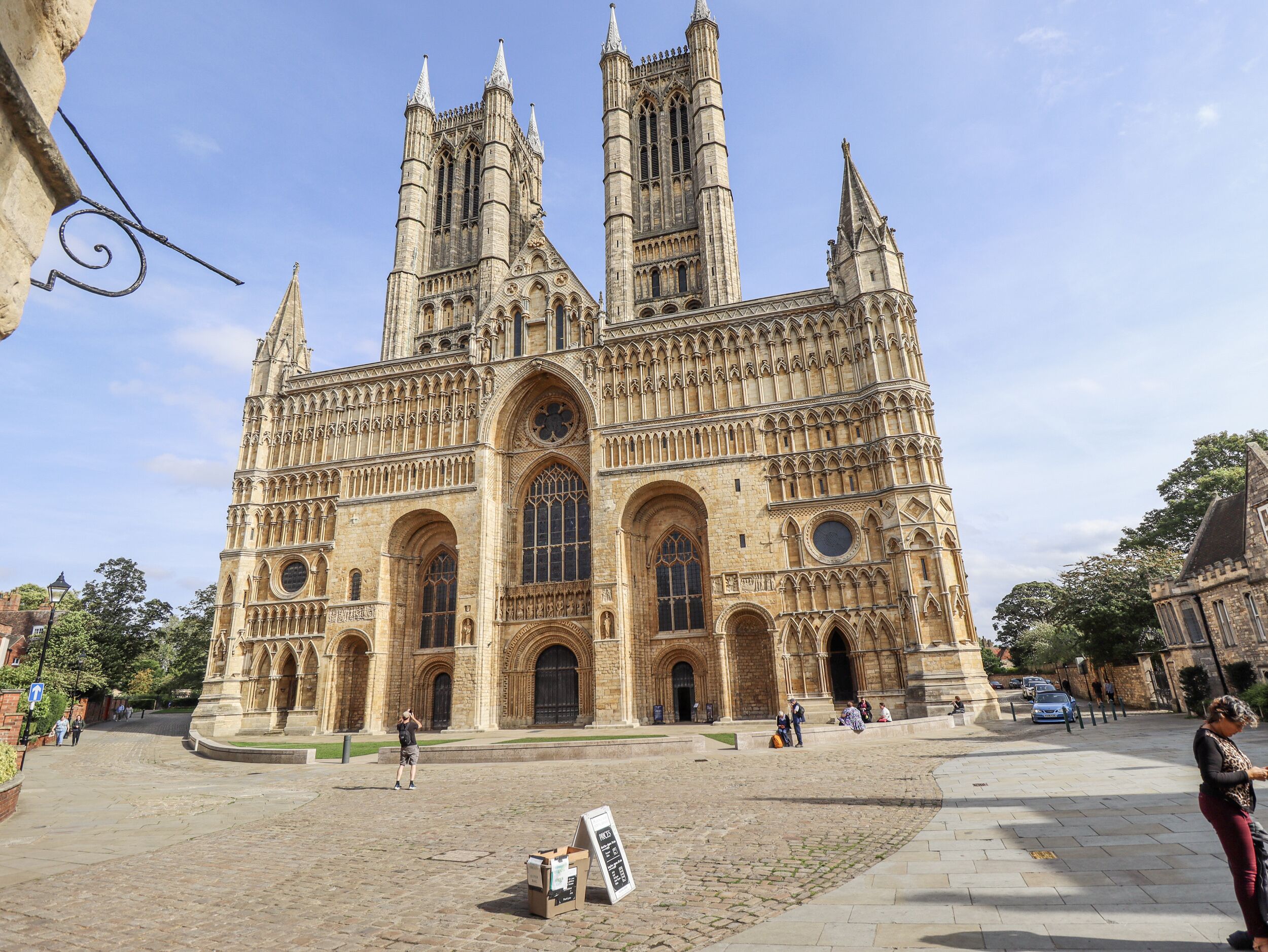 A historic cathedral with multiple towers and large arched windows.