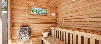 Modern dog-friendly cabin with hot tub, gas fireplace, patio, grill, & washer/dr