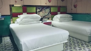 A hotel room with two beds, a nightstand, and a wall with heart decorations. - Yuedi Hotel (Shanghai)