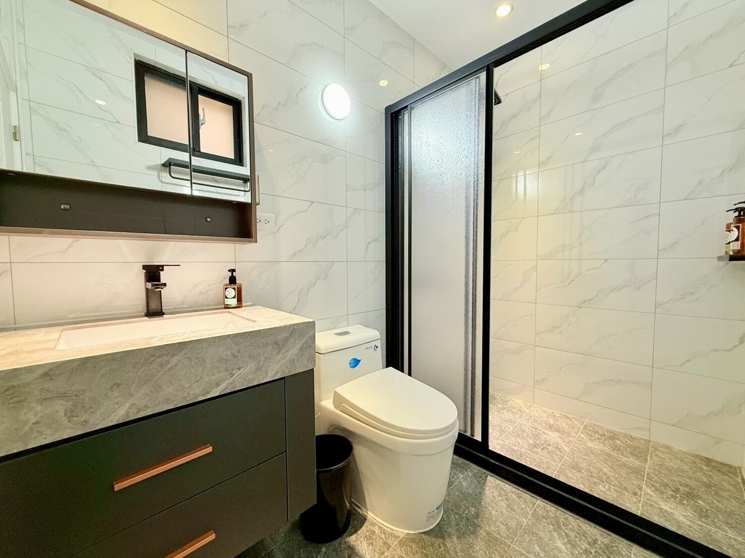 Shower, hair dryer, towels, toilet paper