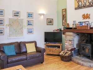 Fireplace - 2 bedroom accommodation in Capel Coch (Capel Coch)