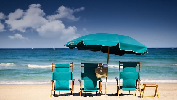 On the beach, sun-loungers, beach towels