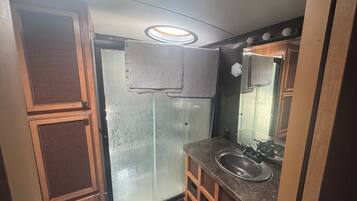 Shower, hair dryer, towels