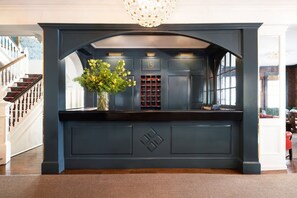 Welcome to our reception area, where a stunning chandelier and elegant decor set the tone for a memorable stay.