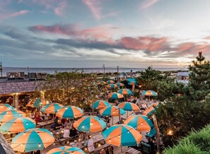 Outdoor dining - Stylish Coastal Living: Beachfront Relaxation with Pool & Entertainment (Cape May)