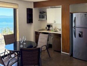 Fridge, microwave, coffee/tea maker, cookware/dishes/utensils