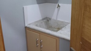 A small bathroom with a sink, a mirror, and a cabinet. - Stay at luxurious exclusive condo 10 minute walk from caleta beach  (La Romana)