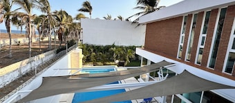 House on the beach near the bar at the foot of the slope (pool and pet friendly)