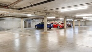 A multi-level parking garage with concrete pillars and a clean, well-lit environment.