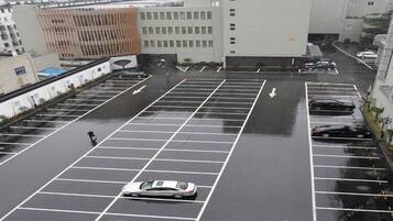 A multi-level parking structure with clear directional arrows on the ground.