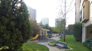 A park with a playground, benches, and a pathway. - Special for business, 2 blocks from the subway! (Ñuñoa)