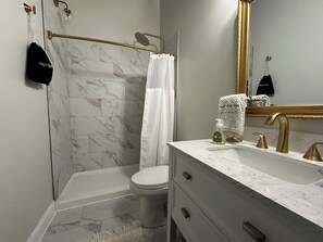 Shower, eco-friendly toiletries, hair dryer, towels