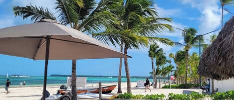 On the beach, sun loungers, beach towels