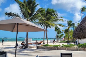 On the beach, sun loungers, beach towels