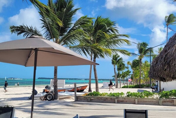 On the beach, sun loungers, beach towels