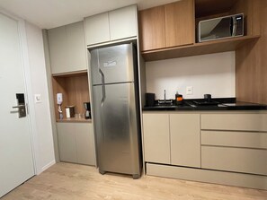 Fridge, microwave, stovetop, coffee/tea maker