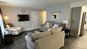 A modern living room with a sofa, armchairs, and a TV. - Welcome to the Moravian! (Allentown)