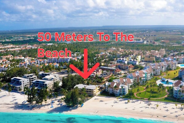 A resort with a beach view, multiple buildings, and a clear sky. - Villa Mare B0 on Bavaro Beach, The best tourists location in Bavaro/Punta Cana (Punta Cana)