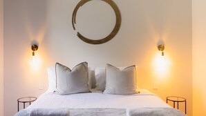 A neatly made bed with white bedding and two pillows, flanked by two wall-mounted light fixtures. - Balangara, Exeter, Southern Highlands (Exeter)