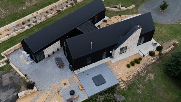 A modern two-story house with a patio, outdoor seating, and a small garden. - Balangara, Exeter, Southern Highlands (Exeter)