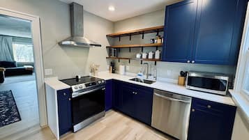 Microwave, cookware/dishes/utensils, dining tables