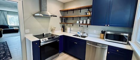 Microwave, cookware/dishes/utensils, dining tables