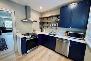 Microwave, cookware/dishes/utensils, dining tables - 3BR Urban Oasis Near Downtown Sioux Falls & Sanford Health (Sioux Falls)