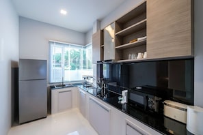 Fridge, microwave, stovetop, coffee/tea maker
