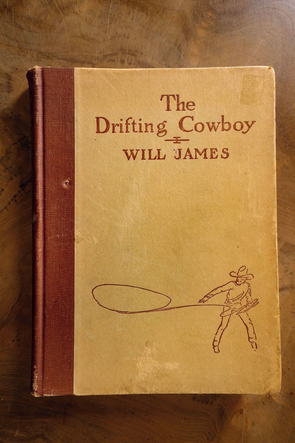 Een boek met de titel 'The Drifting Cowboy' van Will James.