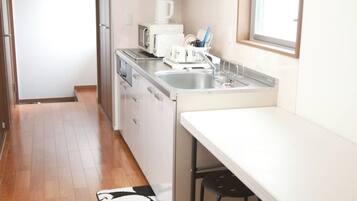 Fridge, microwave, cookware/dishes/utensils