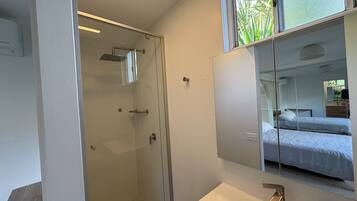 Shower, towels, soap, toilet paper