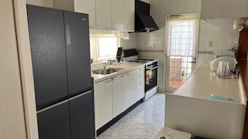 Fridge, microwave, stovetop, cookware/dishes/utensils