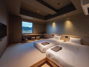 Deluxe Twin Room, River View | In-room safe, desk, free WiFi, bed sheets