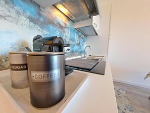Fridge, microwave, stovetop, coffee/tea maker