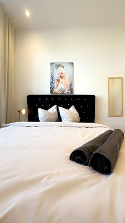 Basic Room | Iron/ironing board. Cozy 3BR Apt Near Kaufpark Alterlaa