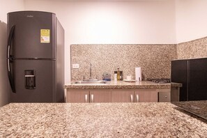 Fridge, microwave, stovetop, cookware/dishes/utensils