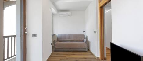 Standard Apartment, Multiple Bedrooms (Residenza I 3 Mori B) | Living area | 21-inch Smart TV with cable channels