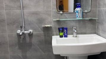 Shower, free toiletries, slippers, towels