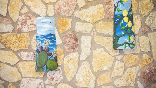 Two paintings on a stone wall. - Apartment Breathtaking View 200 meters from the Sea! (Alcamo)
