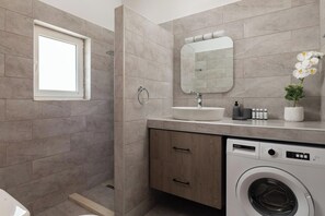 Shower, hair dryer, towels, soap