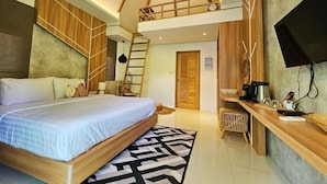 A modern bedroom with a loft bed, a desk, and a TV. - Siri Lagoona Resort & Pool Villa (Bang Lamung)
