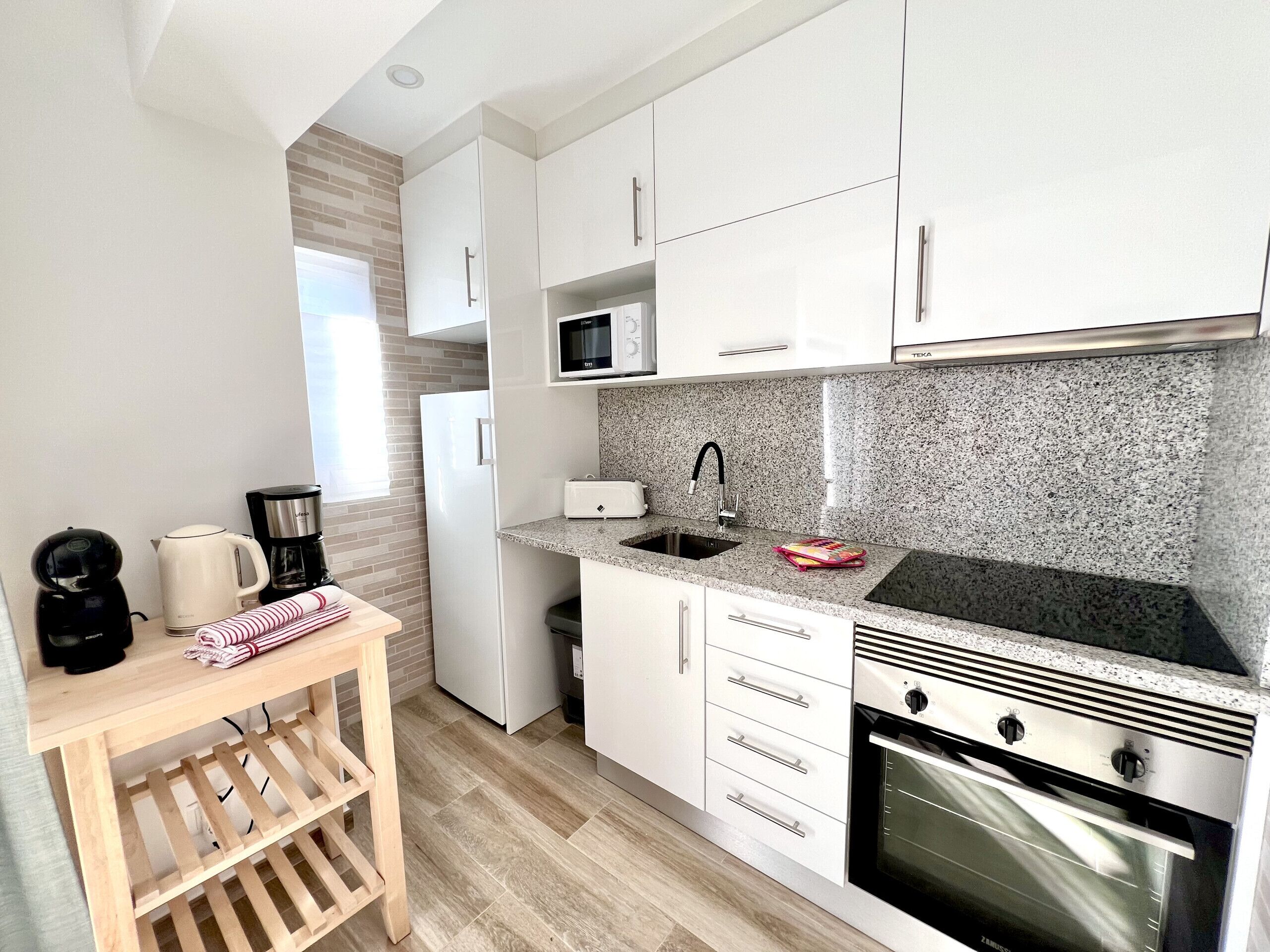 Microwave, coffee/tea maker, cookware/dishes/utensils