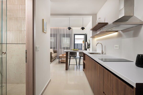 Fridge, microwave, stovetop, coffee/tea maker